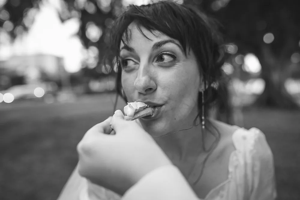 Bride being fed snacks